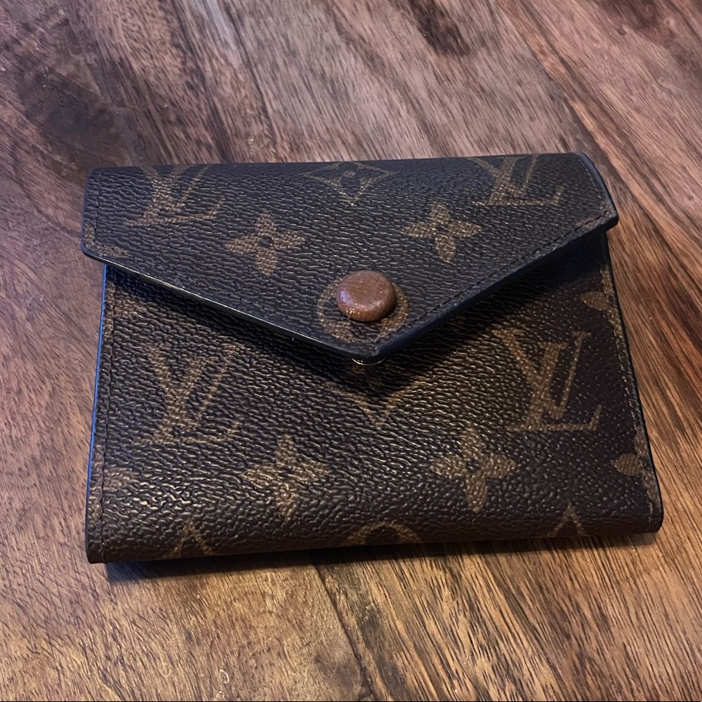 Monogram LV style tri-fold wallet. Tan interior. Leather.